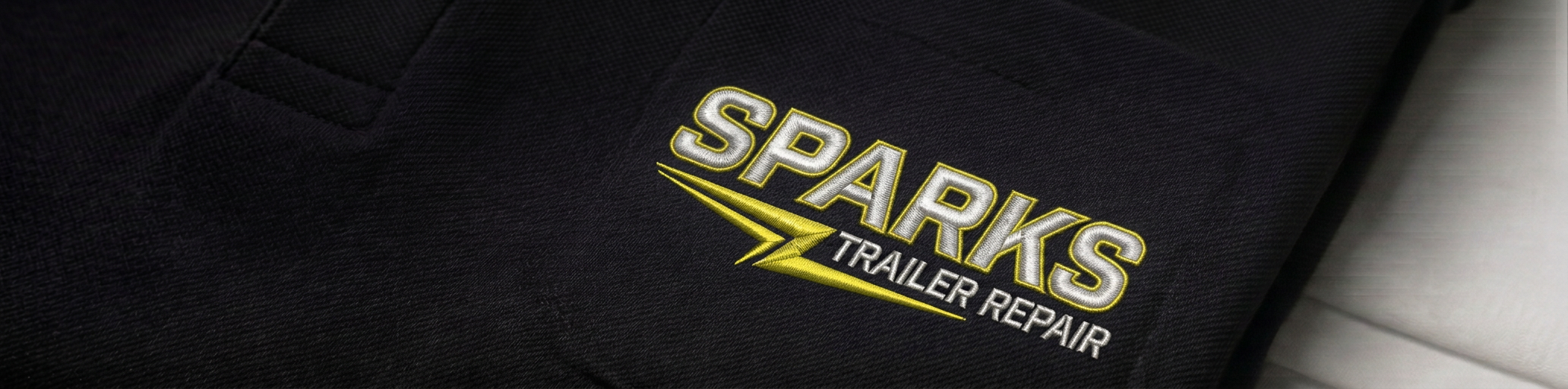SPARKS Trailer Repair embroidered logo on work shirt