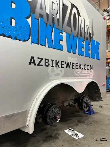 Arizona Bike Week trailer up on jack stands for hub service