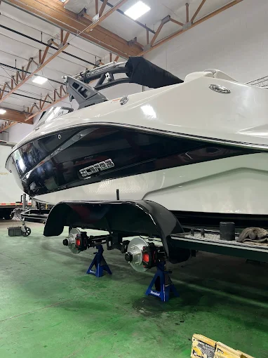 Boat trailer on jack stands for Dexter Vault hub service
