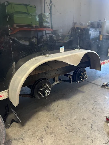 Trailer fender removed for axle and brake service